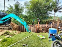 Efisiensi Kinerja TMMD Kodim 0909/Kutai Timur: Alat Berat Percepat Pembangunan Jembatan Suka Rahmat