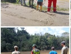 Cuaca Yang Tidak Menentu Babinsa Koramil 01/Sungaimas Laksanakan Giat Pemantauan Air Sungai di Desa Binaan