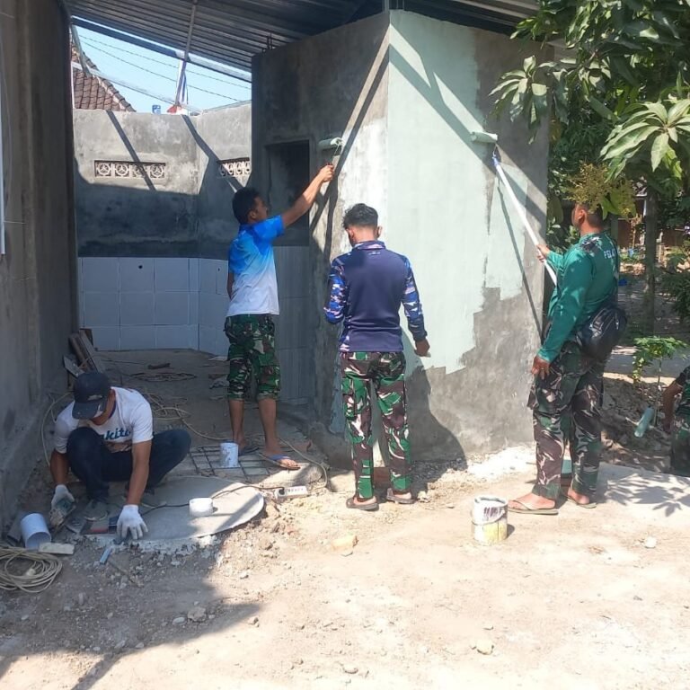 Warga dan Satgas TMMD Selesaikan Pengecatan Tempat Wudhu Masjid Al Mubarok